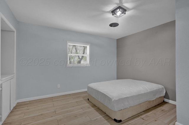 912 W Bonita Ave, Amarillo, TX 79108 - bedroom featuring baseboards and light wood finished floors