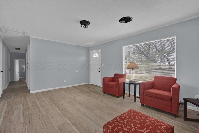 912 W Bonita Ave, Amarillo, TX 79108 - sitting room featuring crown molding, a textured ceiling, and wood finished floors