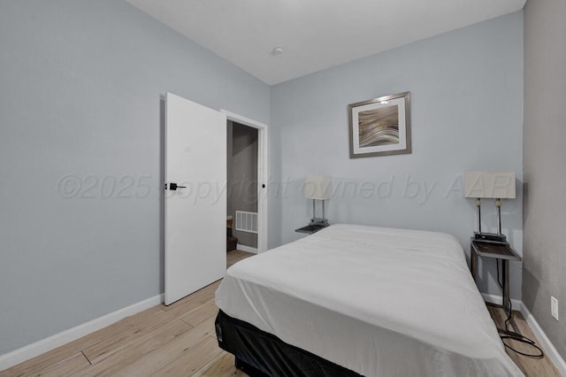 912 W Bonita Ave, Amarillo, TX 79108 - bedroom with visible vents, light wood finished floors, and baseboards