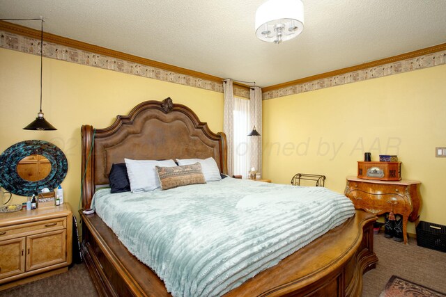 4602 S Georgia St, Amarillo, TX 79110 - bedroom with dark carpet, ornamental molding, and a textured ceiling