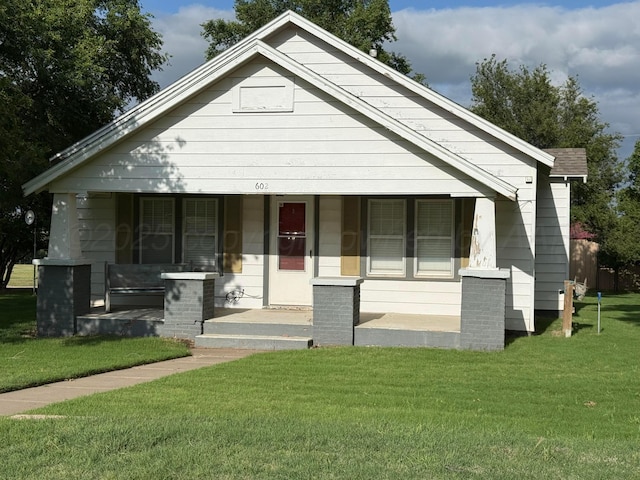 602 S Young St, Follett, TX 79034 - bungalow-style house with a porch and a front lawn