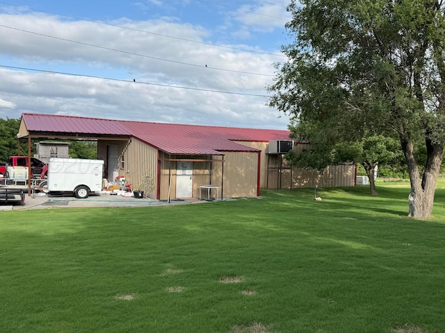 602 S Young St, Follett, TX 79034 - view of grassy yard featuring an outbuilding and a pole building