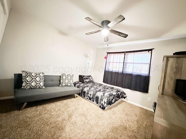 bedroom featuring baseboards, a ceiling fan, and carpet