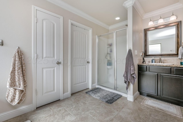 8906 Witmer Ct, Amarillo, TX 79119 - bathroom featuring a shower stall, ornamental molding, vanity, baseboards, and tile patterned flooring