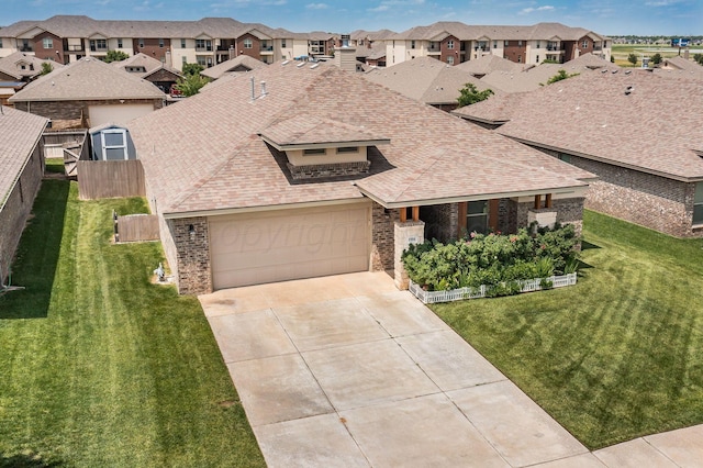 8906 Witmer Ct, Amarillo, TX 79119 - view of front of house featuring brick siding, a residential view, a shingled roof, driveway, and a garage