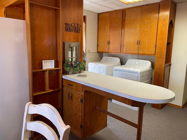 laundry area with cabinet space, carpet flooring, and washing machine and dryer