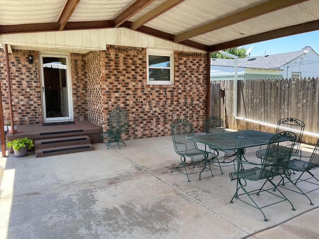 view of patio / terrace featuring outdoor dining space and fence