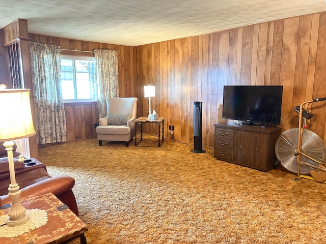 carpeted living area with wooden walls