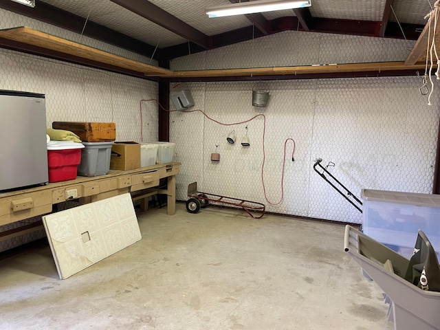 below grade area with refrigerator