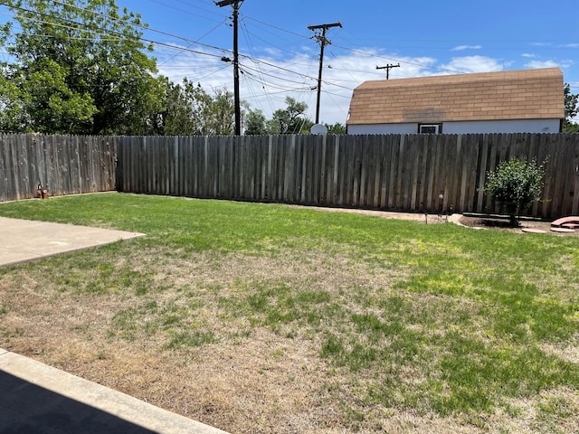 view of yard with a fenced backyard