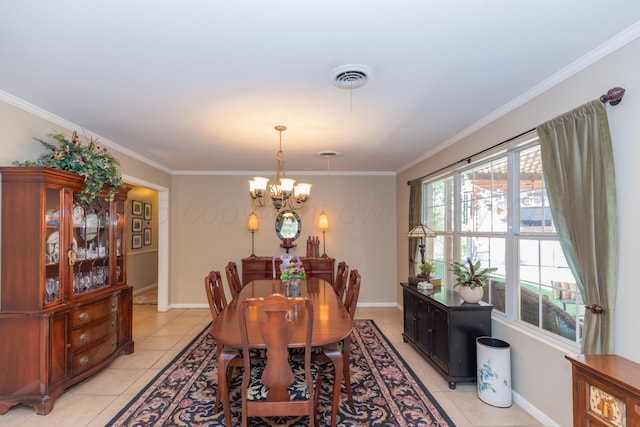 2314 Atkinsen St, Amarillo, TX 79106 - dining space with a chandelier, light tile patterned floors, and crown molding