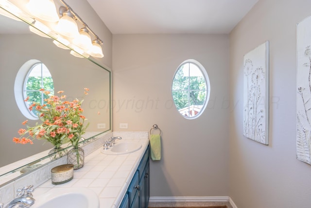 2314 Atkinsen St, Amarillo, TX 79106 - bathroom featuring double vanity and baseboards