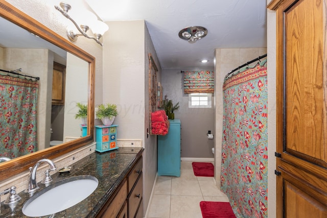2314 Atkinsen St, Amarillo, TX 79106 - bathroom with tile patterned floors, vanity, and a shower with curtain