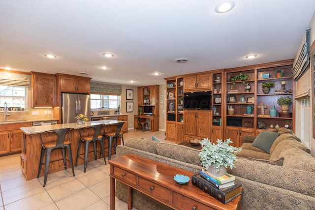2314 Atkinsen St, Amarillo, TX 79106 - living room with recessed lighting and light tile patterned floors
