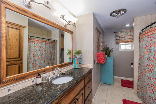 2314 Atkinsen St, Amarillo, TX 79106 - full bath featuring tile patterned flooring, vanity, and curtained shower