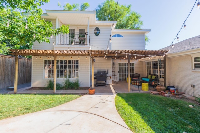 2314 Atkinsen St, Amarillo, TX 79106 - back of property featuring a balcony, a patio area, and a pergola