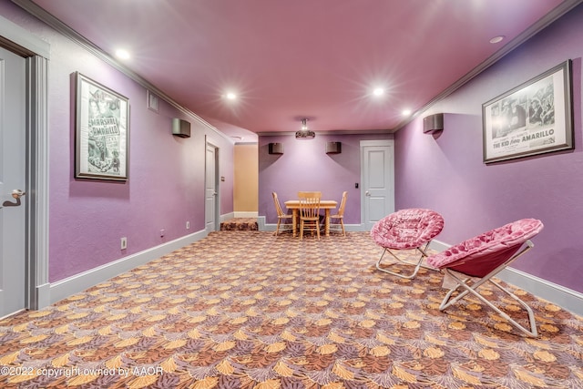 cinema room featuring carpet floors and crown molding