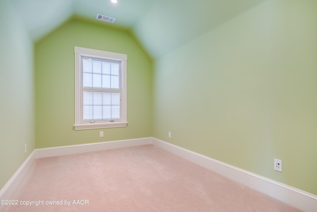 bonus room featuring lofted ceiling and carpet floors