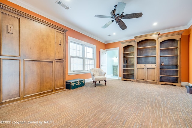 unfurnished room with ceiling fan, ornamental molding, and light carpet