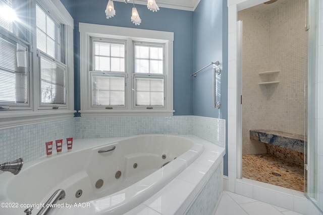 bathroom featuring tile patterned flooring and independent shower and bath