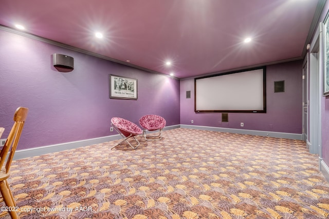 home theater with carpet flooring and ornamental molding