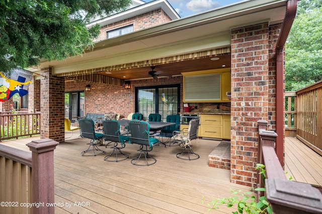 wooden deck featuring ceiling fan