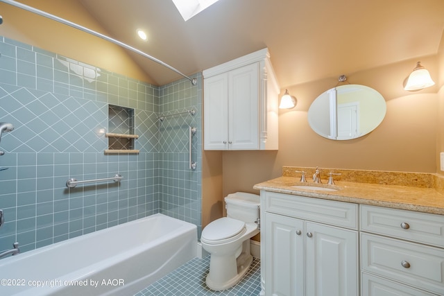 full bathroom featuring tiled shower / bath combo, tile patterned flooring, lofted ceiling, toilet, and vanity