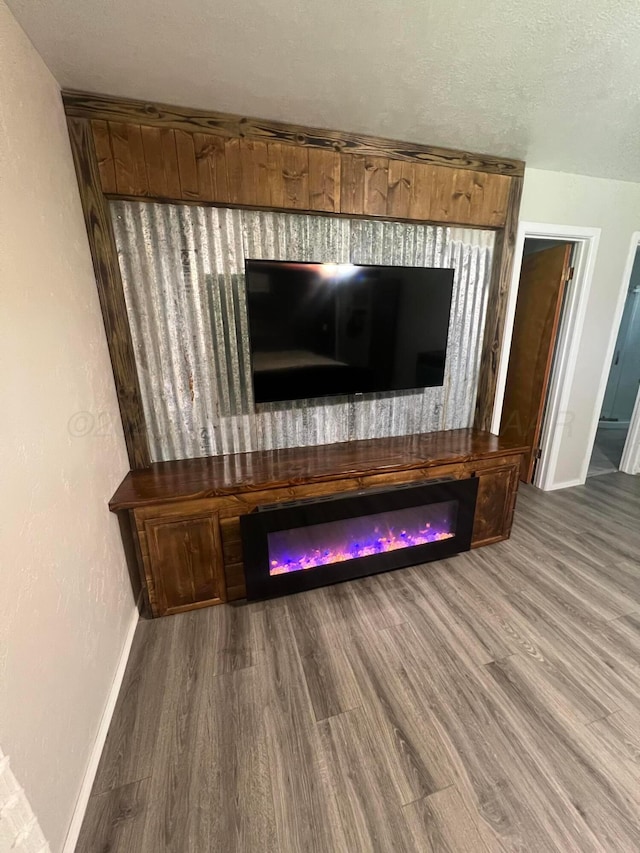 room details featuring hardwood / wood-style floors and a textured ceiling