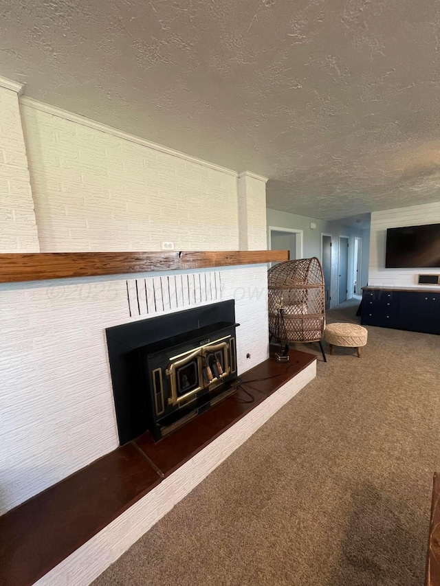 interior space with a textured ceiling and carpet