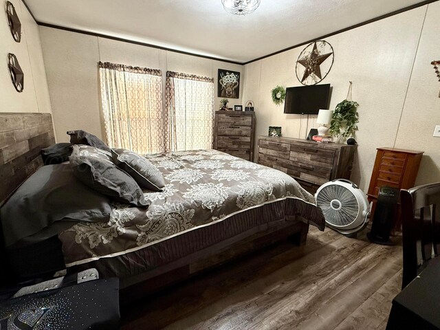420 N 18th St, Memphis, TX 79245 - bedroom featuring crown molding and wood finished floors