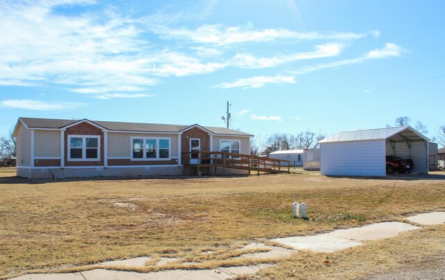 420 N 18th St, Memphis, TX 79245 - view of front of property with a front lawn and a carport