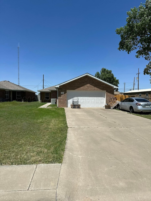 ranch-style house with a garage, a front lawn, brick siding, and driveway