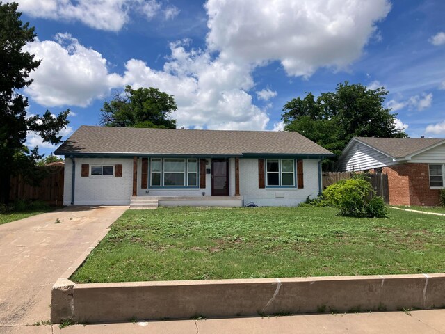 3704 Westlawn Ave, Amarillo, TX 79102 - ranch-style house with concrete driveway, brick siding, and roof with shingles