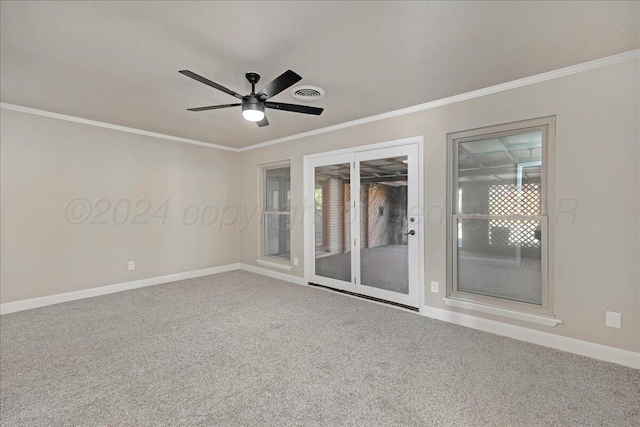 empty room with carpet floors, ceiling fan, and ornamental molding