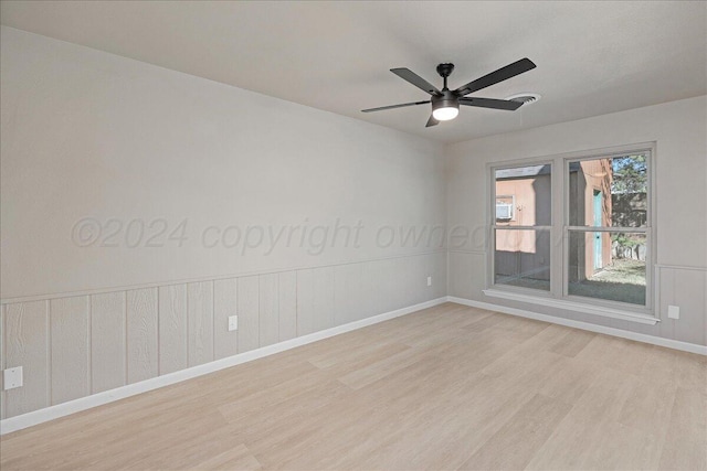 empty room featuring light hardwood / wood-style floors and ceiling fan