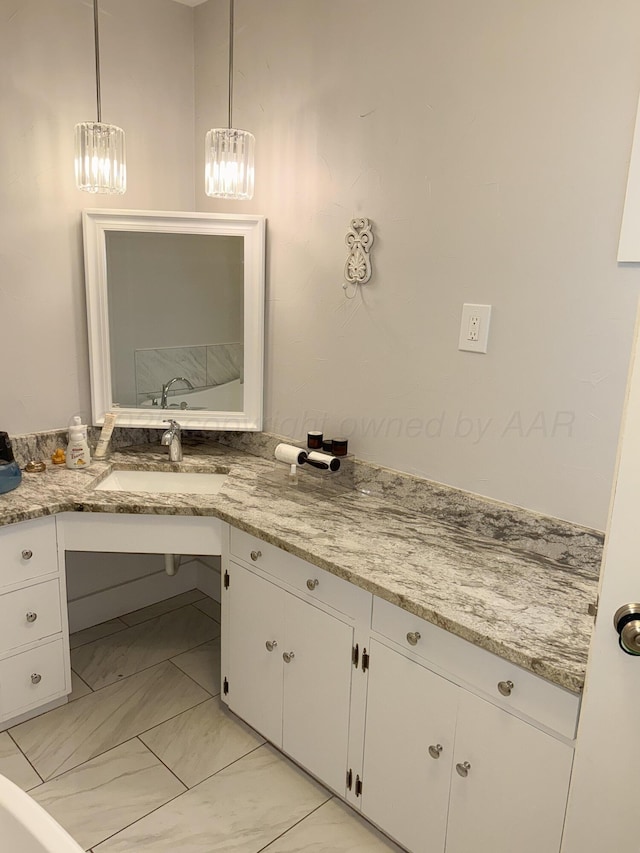 1105 Main St, Panhandle, TX 79068 - bathroom with a chandelier, marble look tile flooring, and vanity