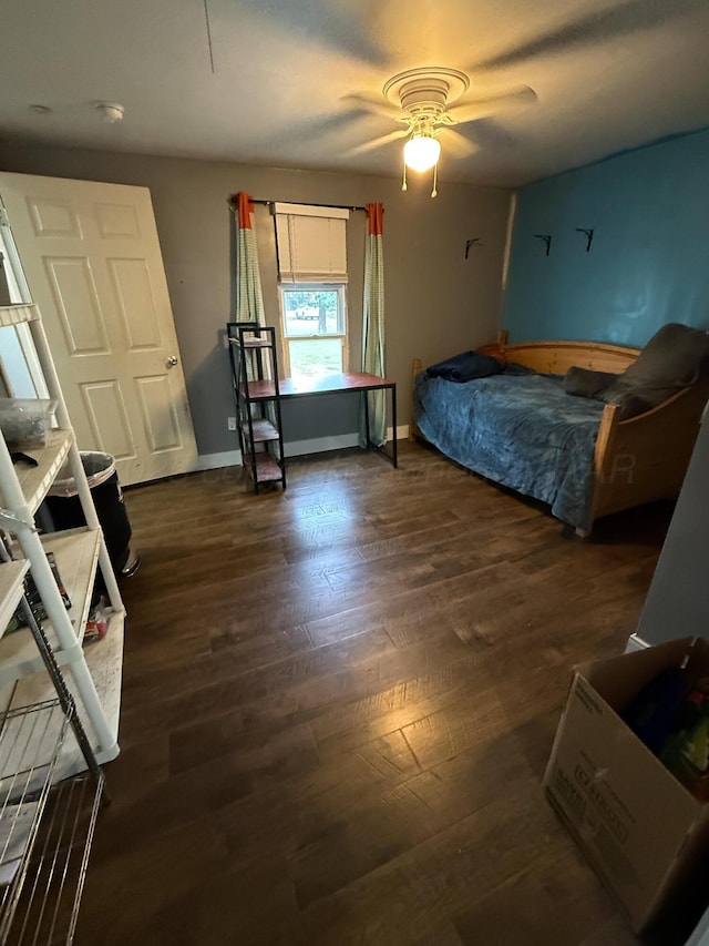 1105 Main St, Panhandle, TX 79068 - bedroom with dark wood finished floors and ceiling fan