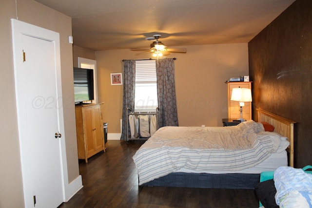1105 Main St, Panhandle, TX 79068 - bedroom featuring dark wood finished floors and ceiling fan