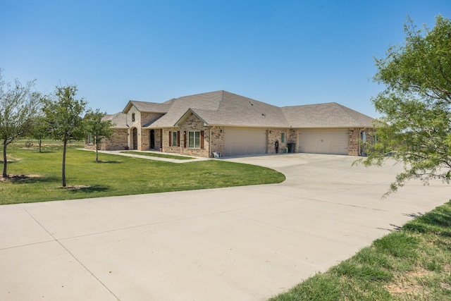 view of front facade with a front yard and a garage