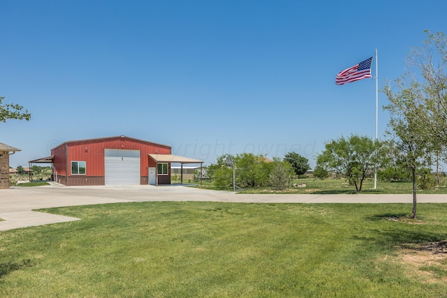 exterior space featuring a carport, a garage, and an outdoor structure