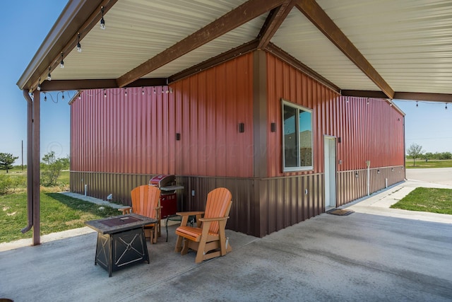 view of patio featuring area for grilling and an outdoor fire pit