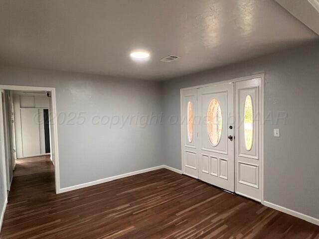 1605 S Colgate St, Perryton, TX 79070 - foyer entrance featuring baseboards and dark wood-style floors