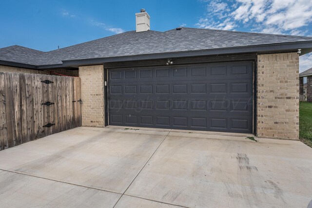 3005 Portland Ave, Amarillo, TX 79118 - garage with driveway and a gate