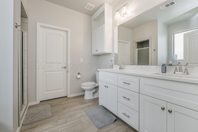 3005 Portland Ave, Amarillo, TX 79118 - full bath with double vanity, a shower stall, and wood finished floors