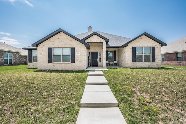 3005 Portland Ave, Amarillo, TX 79118 - view of front facade with a chimney, a front lawn, and brick siding