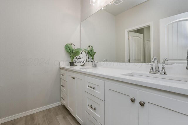 3005 Portland Ave, Amarillo, TX 79118 - full bath with double vanity and wood finished floors