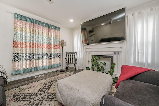 1033 Bowie St, Amarillo, TX 79102 - bedroom featuring a fireplace, wood finished floors, baseboards, and recessed lighting