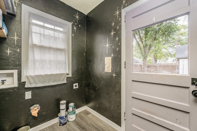 1033 Bowie St, Amarillo, TX 79102 - bathroom featuring wood finished floors, baseboards, and plenty of natural light
