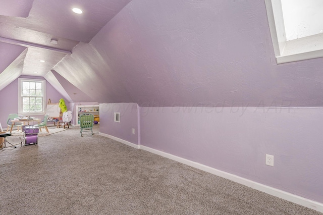 1033 Bowie St, Amarillo, TX 79102 - game room with baseboards, lofted ceiling, and carpet
