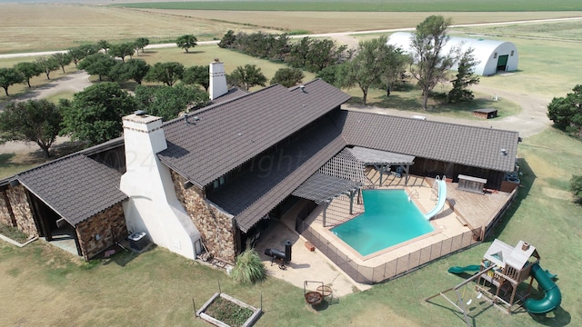 birds eye view of property with a rural view